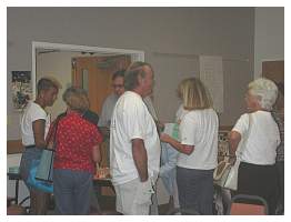 01 Incoming crowd. Paul Mikkelsen chatting with Eleanor Hillman.JPG